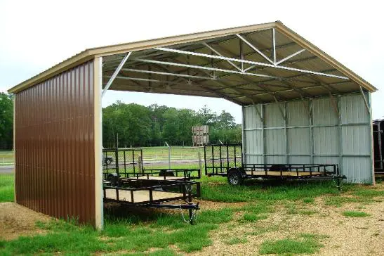 A covered area with several trailers and a metal roof.