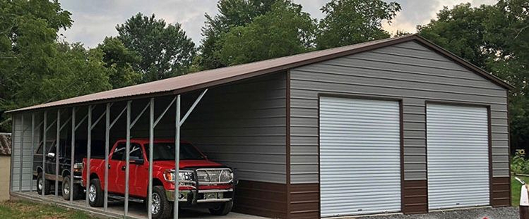 A red truck parked in the driveway of a garage.